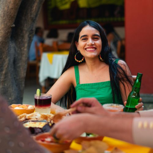 Woman in Green Tank Top Smiling